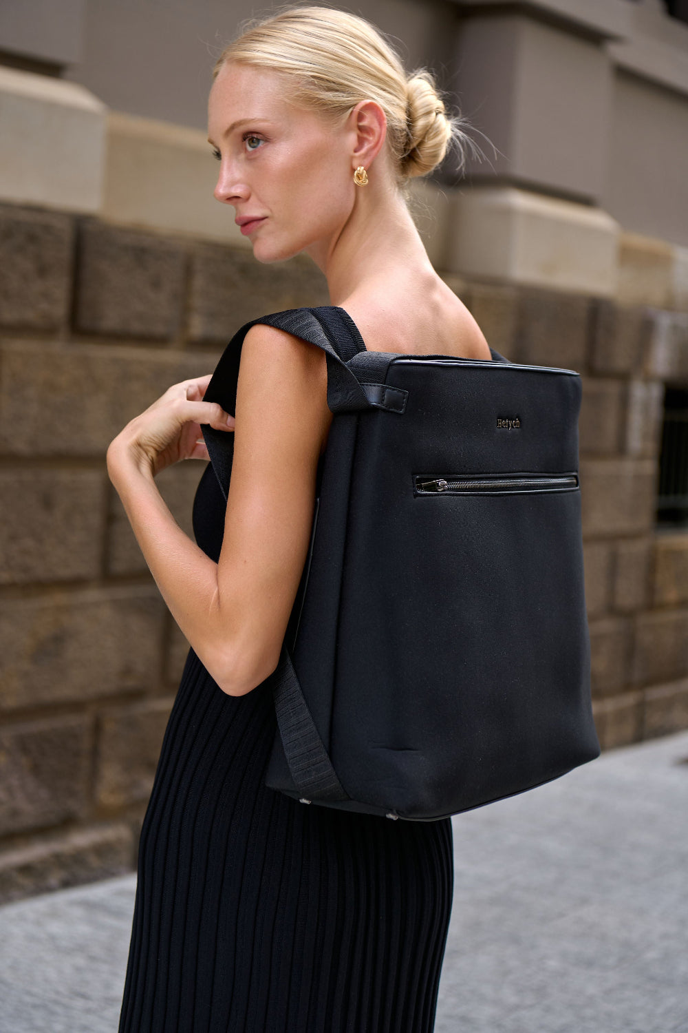 Black convertible tote backpack bag in neoprene with gunmetal hardware