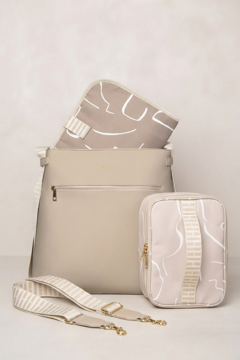 Taupe backpack with matching pouch and hat on a light gray background
