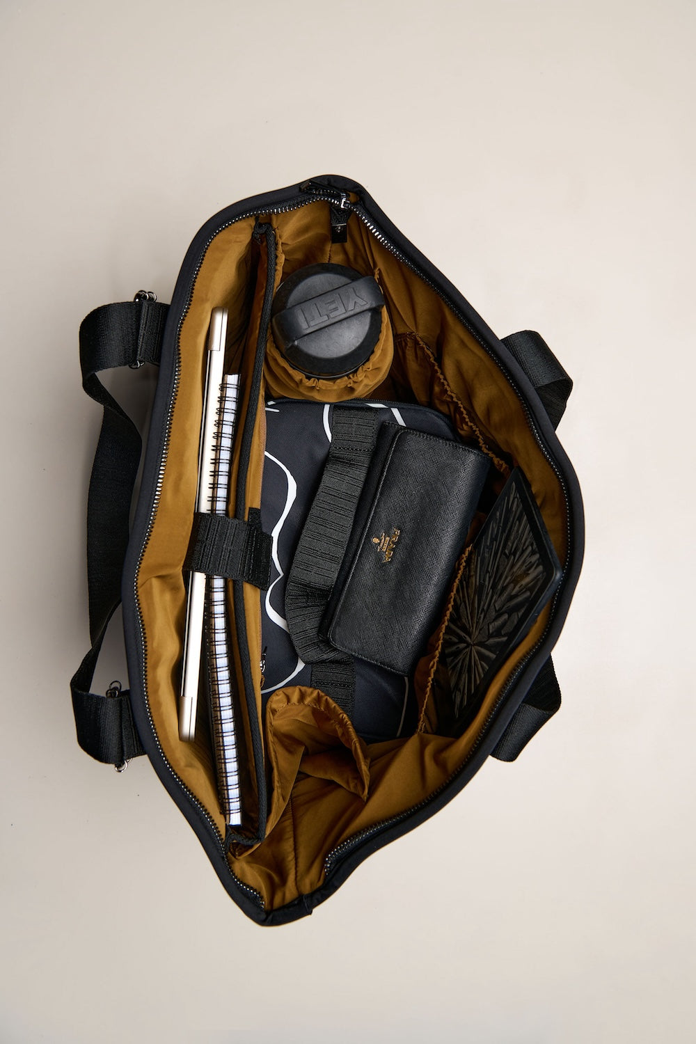 Black carry all womens convertible tote backpack bag in neoprene XL with adjustable straps with laptop inside