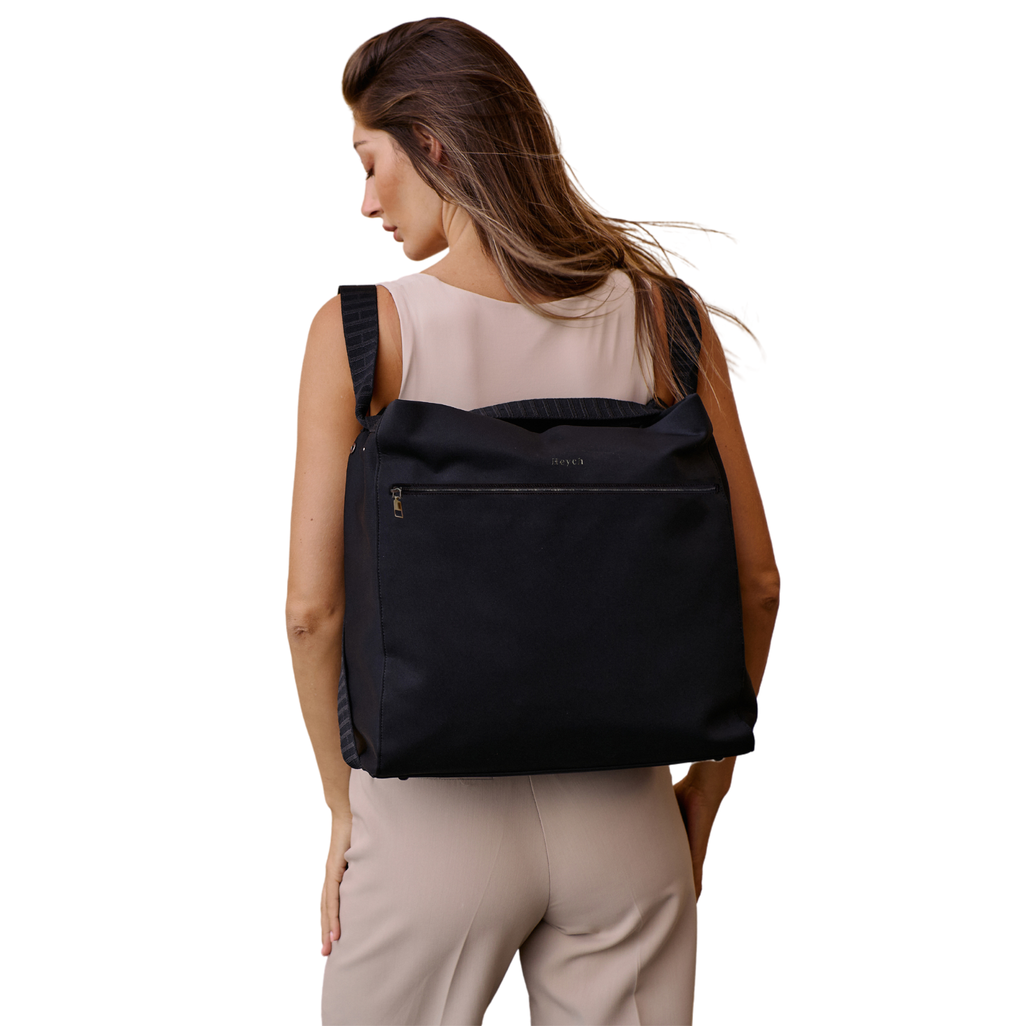 Baby bag converted from a tote bag to a backpack worn by an instagram mum.