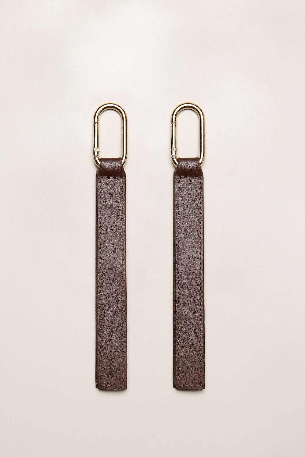 Chocolate brown leather pram straps with gold metal rings