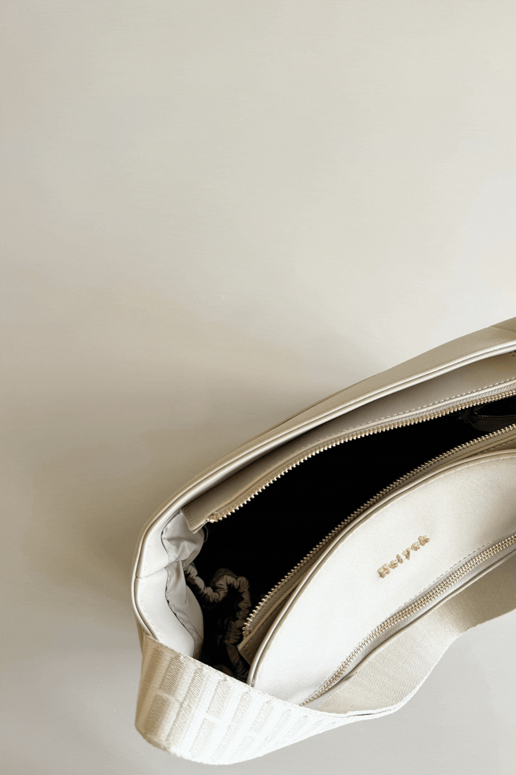 Taupe cream bag with laptop inside