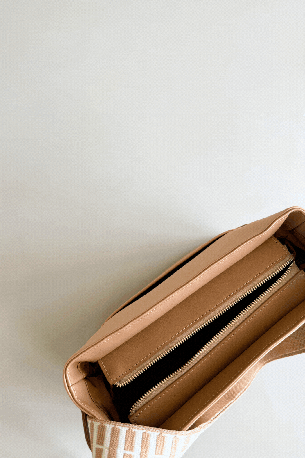 Tan bag with laptop inside