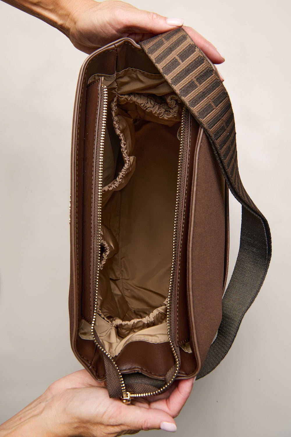 Chocolate brown convertible tote backpack bag in neoprene with gold hardware inside pockets 