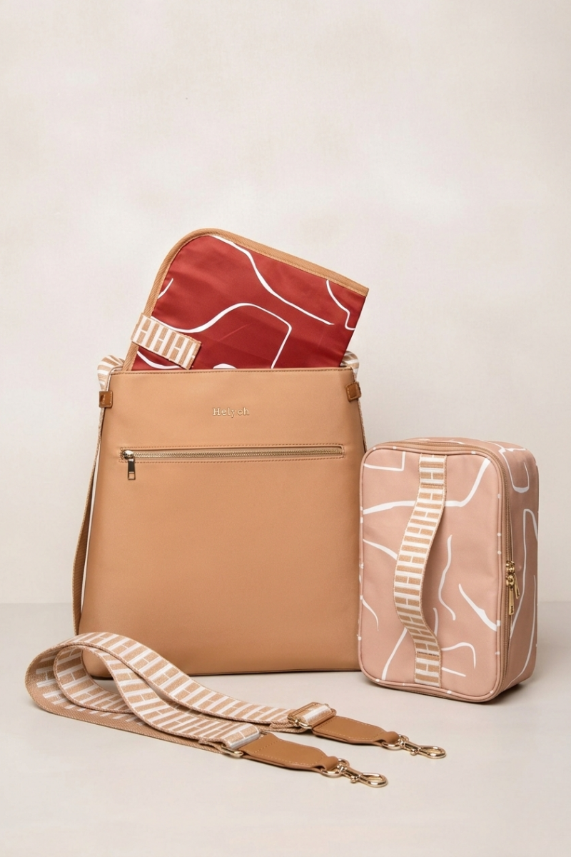 Tan crossbody bag with a matching pouch on a light beige background