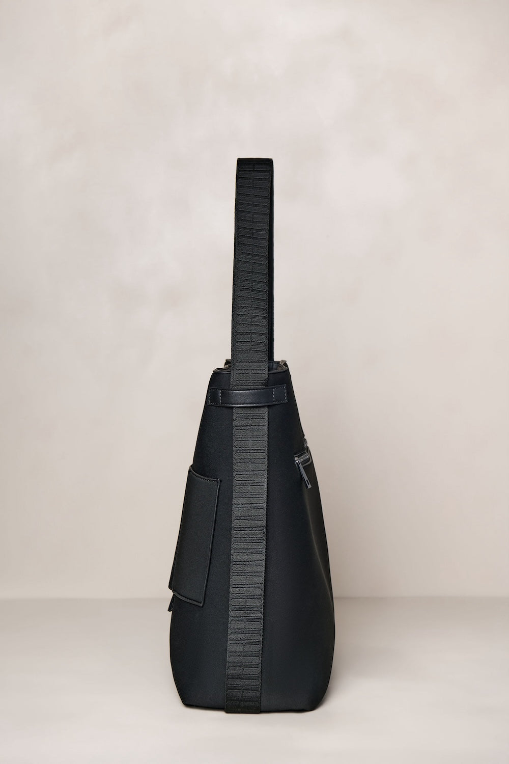 Black convertible tote backpack bag in neoprene with gunmetal hardware