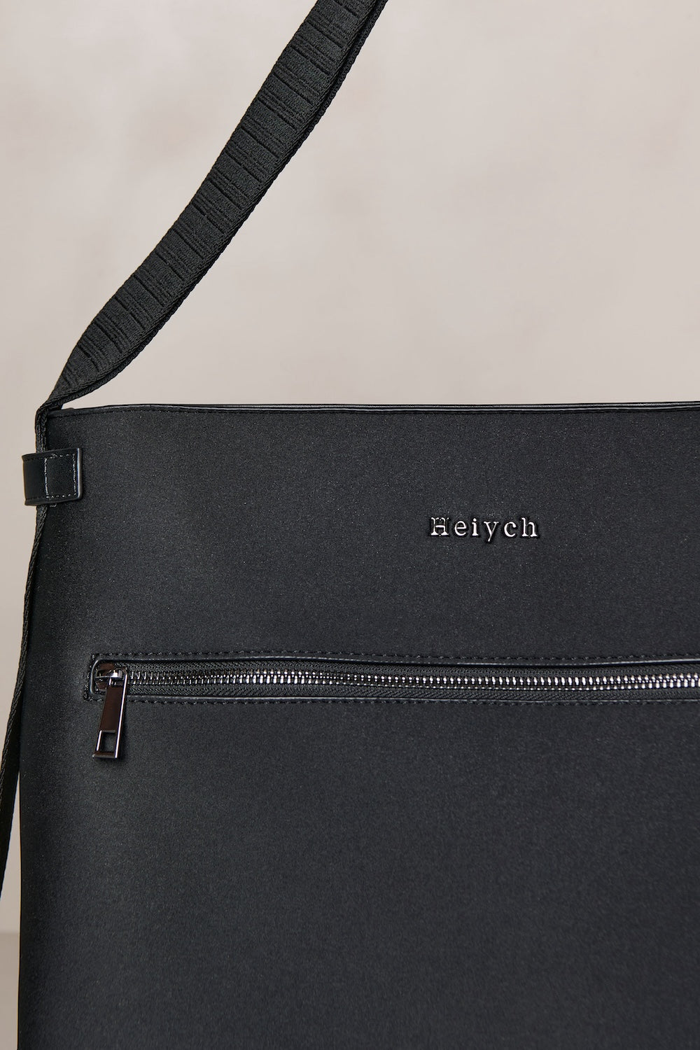 Black convertible tote backpack bag in neoprene with gunmetal hardware