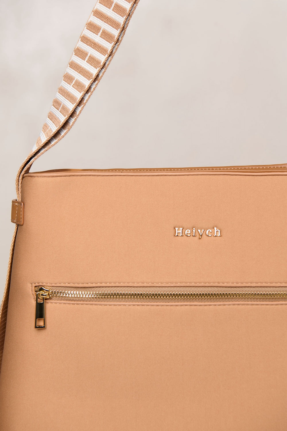 Tan handbag with gold hardware